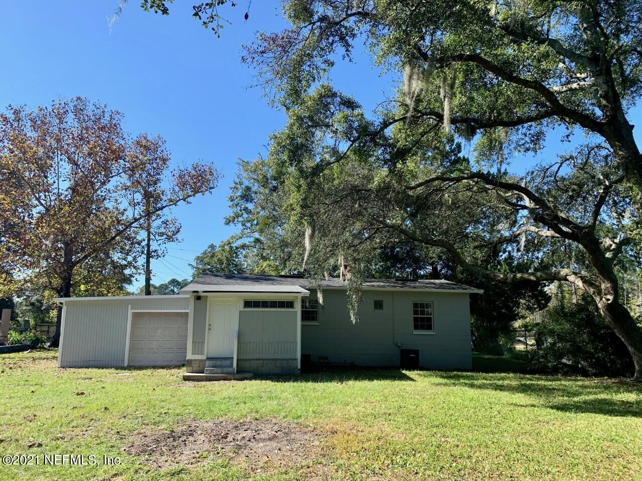 11661 Dewitt Road Jacksonville, FL 32218 - Photo 14 of 14 a view of a house with a yard