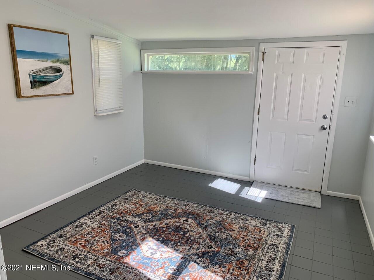 11661 Dewitt Road Jacksonville, FL 32218 - Photo 9 of 14 a view of an empty room with a rug