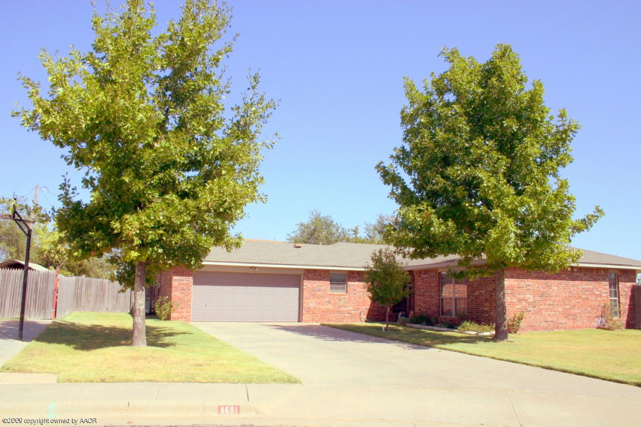 6601 Slater Circle Amarillo, TX 79110 - Photo 2 of 31 a house that has a tree in front of it