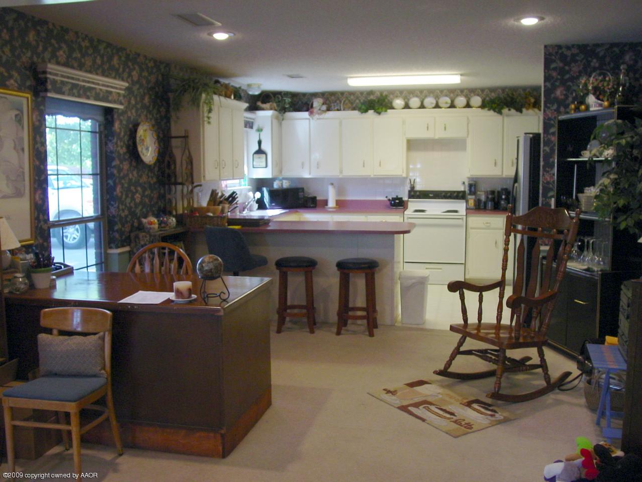 6601 Slater Circle Amarillo, TX 79110 - Photo 11 of 31 a large kitchen with a table and chairs