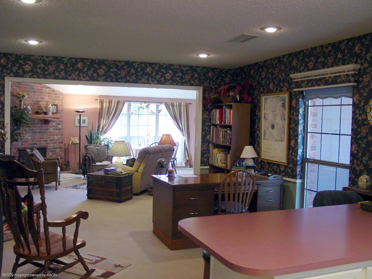 6601 Slater Circle Amarillo, TX 79110 - Photo 15 of 31 a living room with furniture a rug and a large window