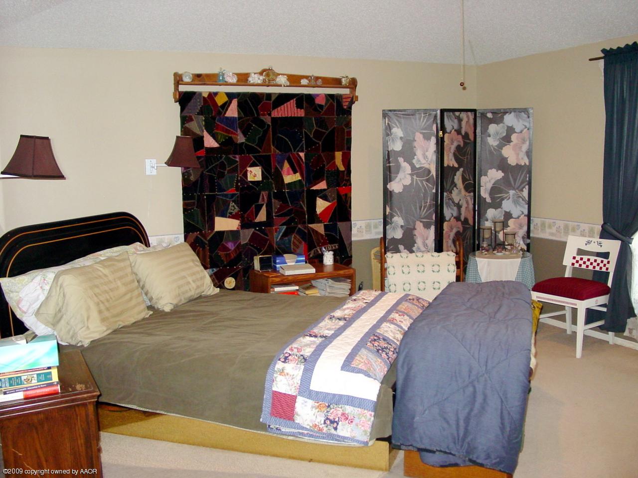 6601 Slater Circle Amarillo, TX 79110 - Photo 17 of 31 a bed room with a bed and a couch
