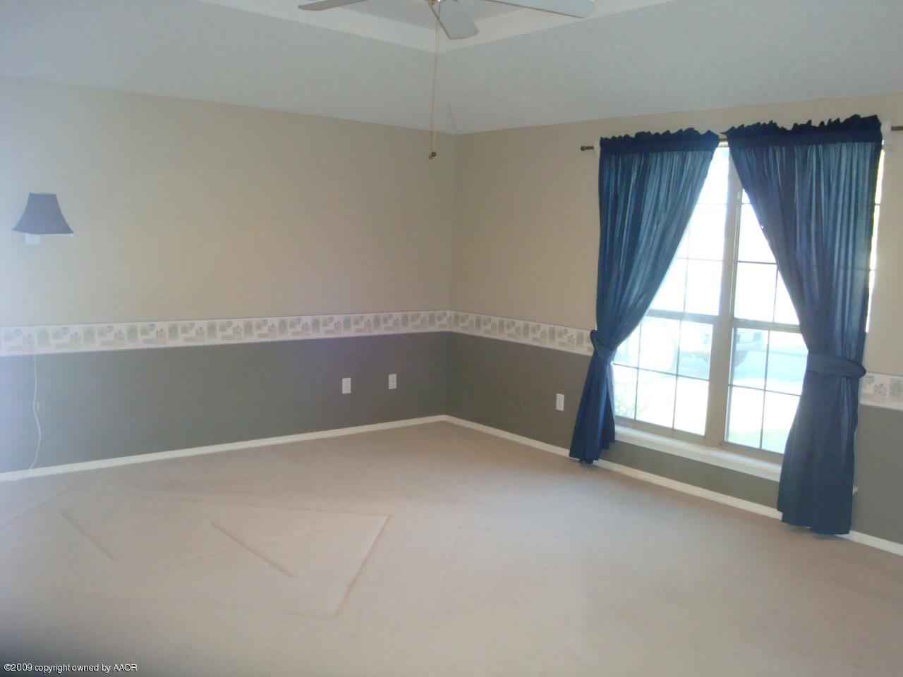 6601 Slater Circle Amarillo, TX 79110 - Photo 18 of 31 an empty room with windows
