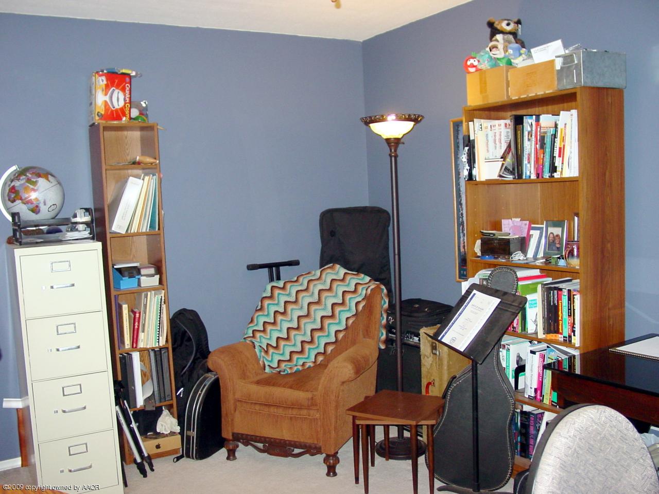 6601 Slater Circle Amarillo, TX 79110 - Photo 23 of 31 a view of a workspace with furniture and a window