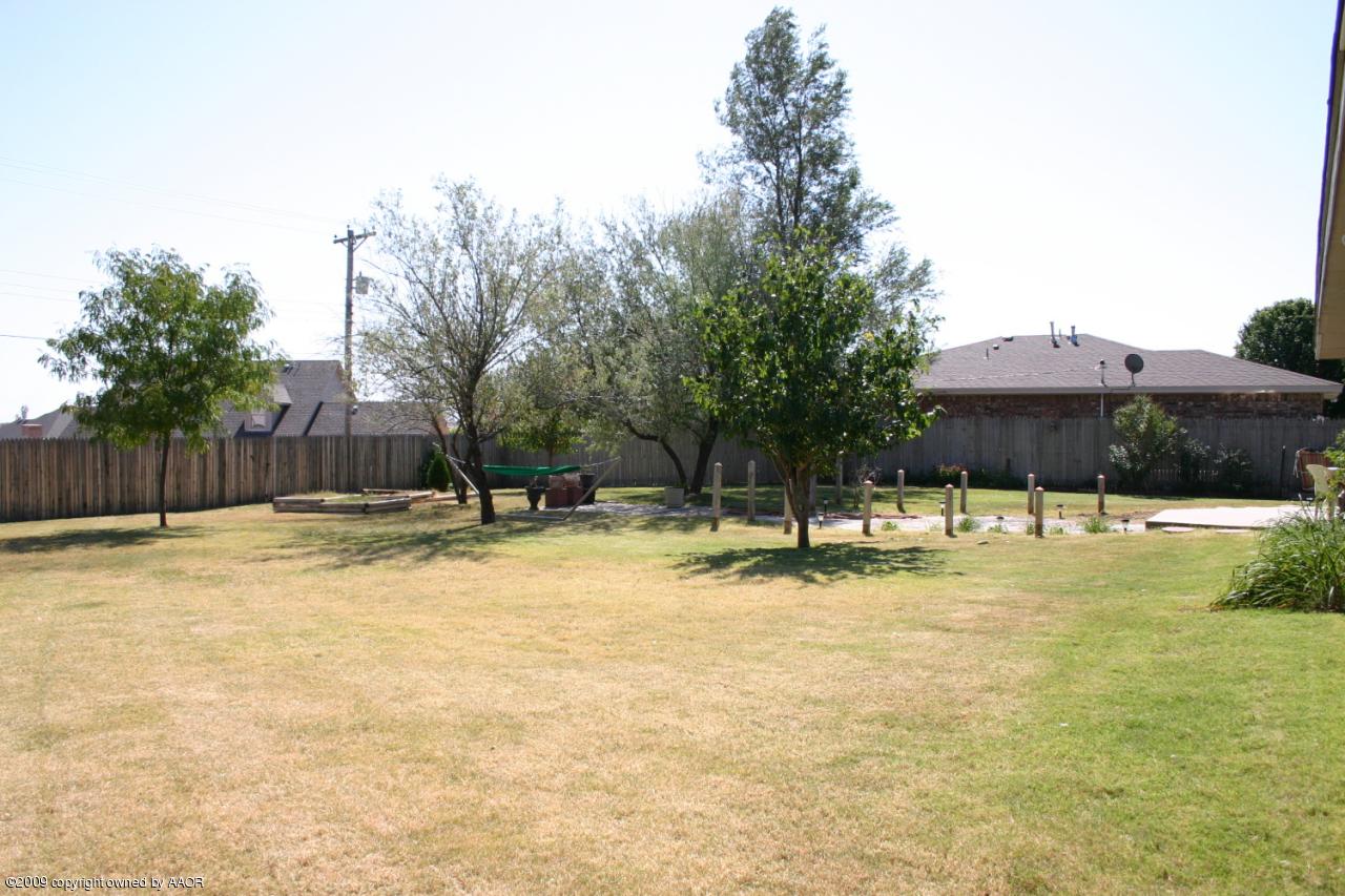 6601 Slater Circle Amarillo, TX 79110 - Photo 28 of 31 a swimming pool with outdoor seating and yard