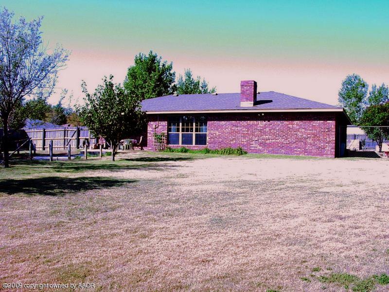 6601 Slater Circle Amarillo, TX 79110 - Photo 29 of 31 a front view of a house with a yard and a road