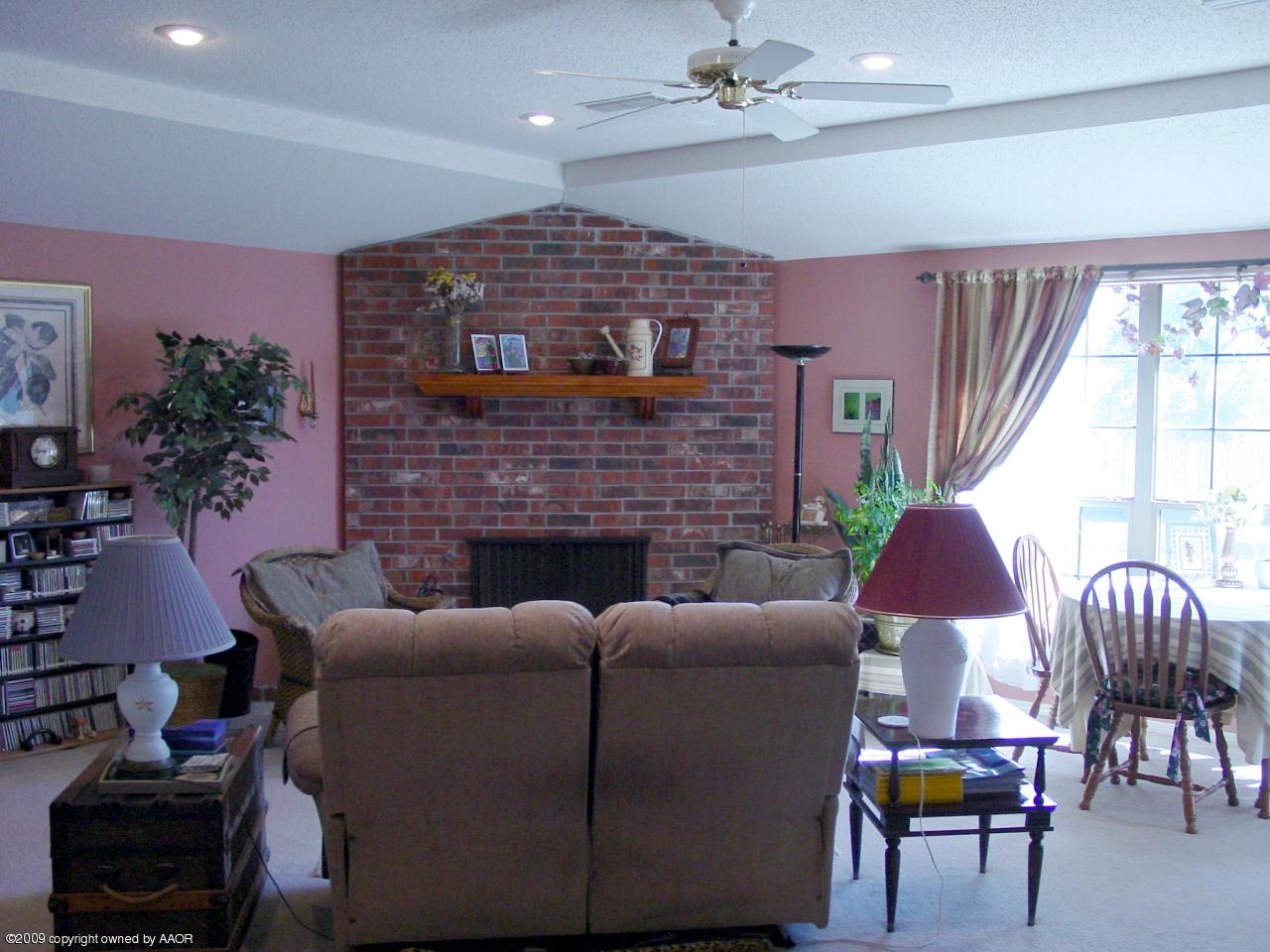 6601 Slater Circle Amarillo, TX 79110 - Photo 5 of 31 a living room with furniture and a fireplace