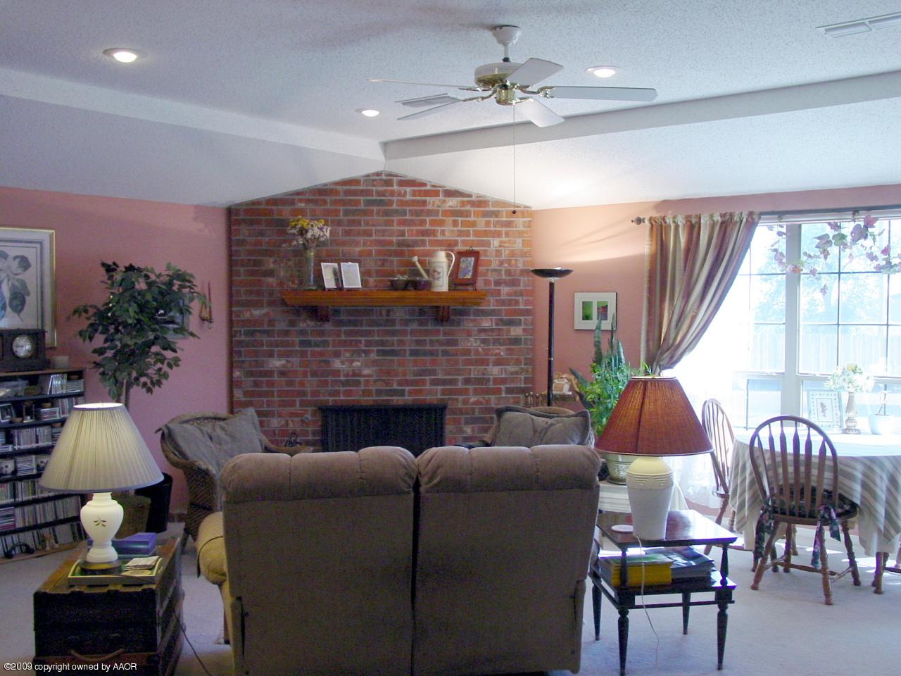6601 Slater Circle Amarillo, TX 79110 - Photo 8 of 31 a living room with furniture and a fireplace