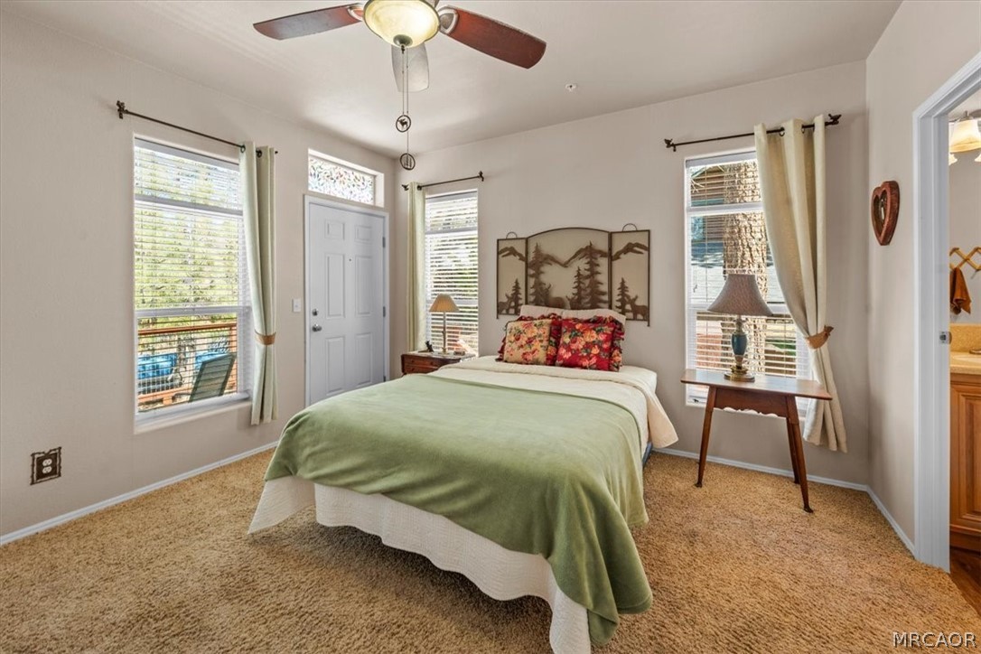 775 Riverside Avenue Sugarloaf, CA 92386 - Photo 11 of 28 a bedroom with a bed and a window