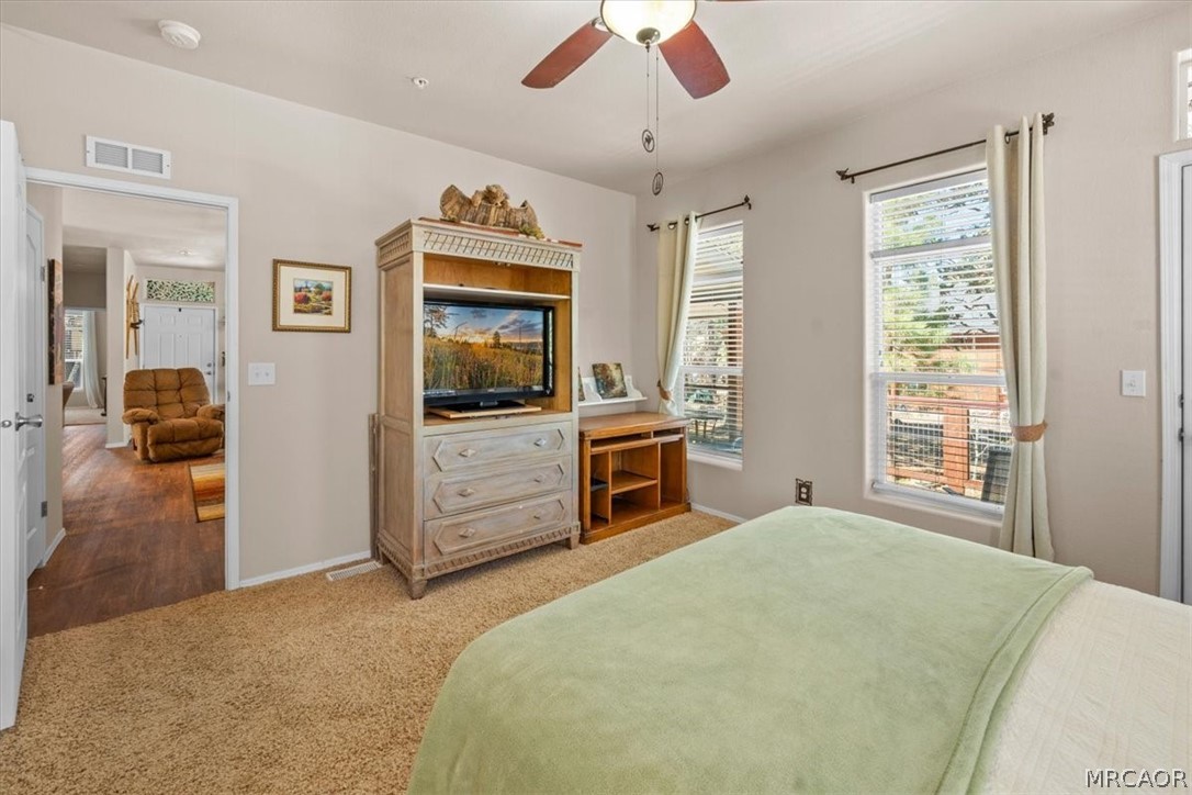 775 Riverside Avenue Sugarloaf, CA 92386 - Photo 12 of 28 a bedroom with a bed and a television