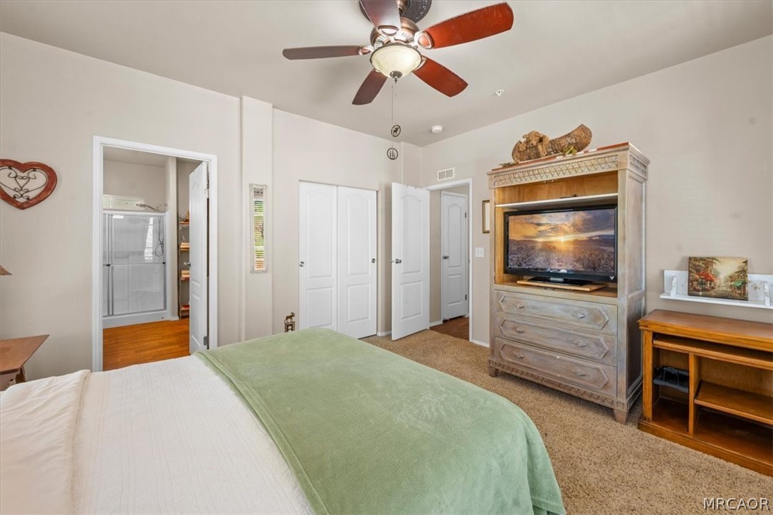 775 Riverside Avenue Sugarloaf, CA 92386 - Photo 13 of 28 a bedroom with a bed and a flat screen tv