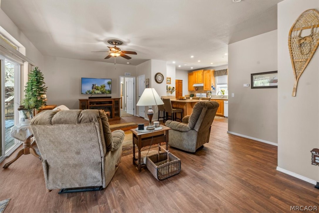 775 Riverside Avenue Sugarloaf, CA 92386 - Photo 3 of 28 a living room with furniture and wooden floor