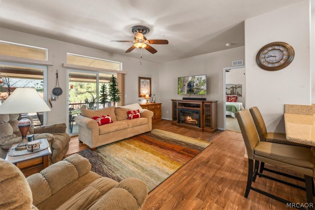 775 Riverside Avenue Sugarloaf, CA 92386 - Photo 4 of 28 a living room with furniture and a flat screen tv