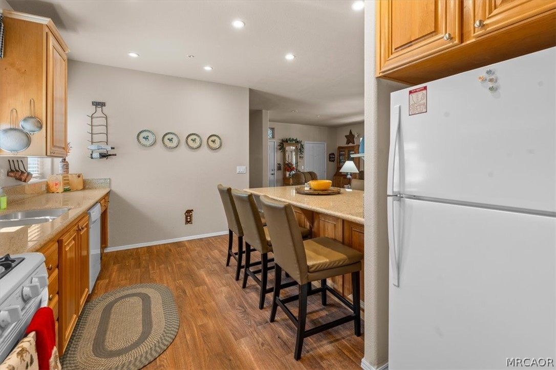 775 Riverside Avenue Sugarloaf, CA 92386 - Photo 10 of 28 a workspace with stainless steel appliances granite countertop a refrigerator and a stove top oven