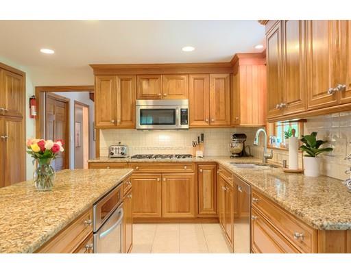 14 Deer Run Road Littleton, MA 01460 - Photo 14 of 41 a kitchen with kitchen island granite countertop a sink counter top space appliances and cabinets