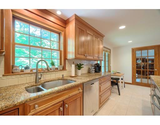14 Deer Run Road Littleton, MA 01460 - Photo 15 of 41 a kitchen with a sink a counter top space and living room area