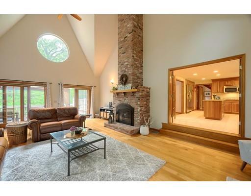 14 Deer Run Road Littleton, MA 01460 - Photo 19 of 41 a living room with furniture a fireplace and a large window