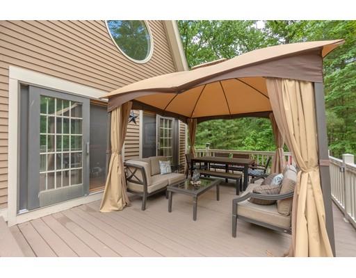 14 Deer Run Road Littleton, MA 01460 - Photo 33 of 41 a balcony with furniture and a umbrella