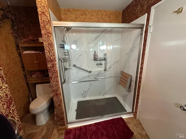 a view of living room with furniture and wooden floor