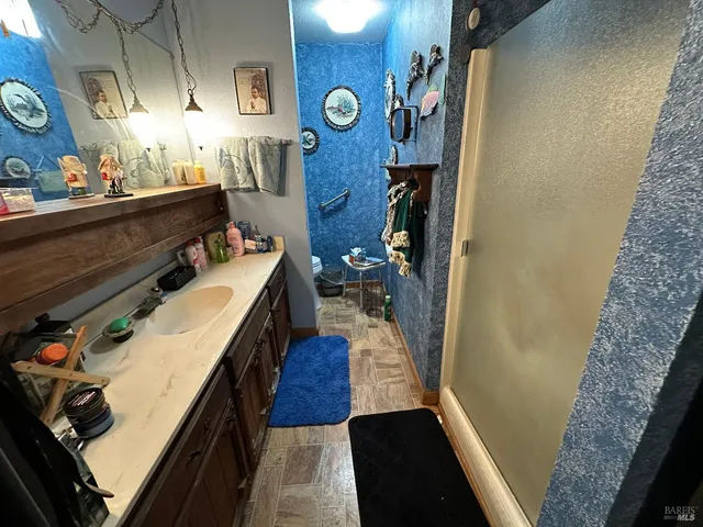 a backyard of a house with table and chairs