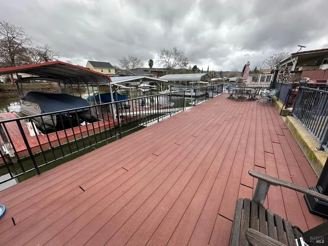 a view of a balcony with wooden floor