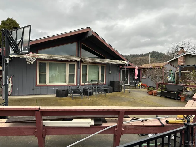 a view of house with outdoor seating