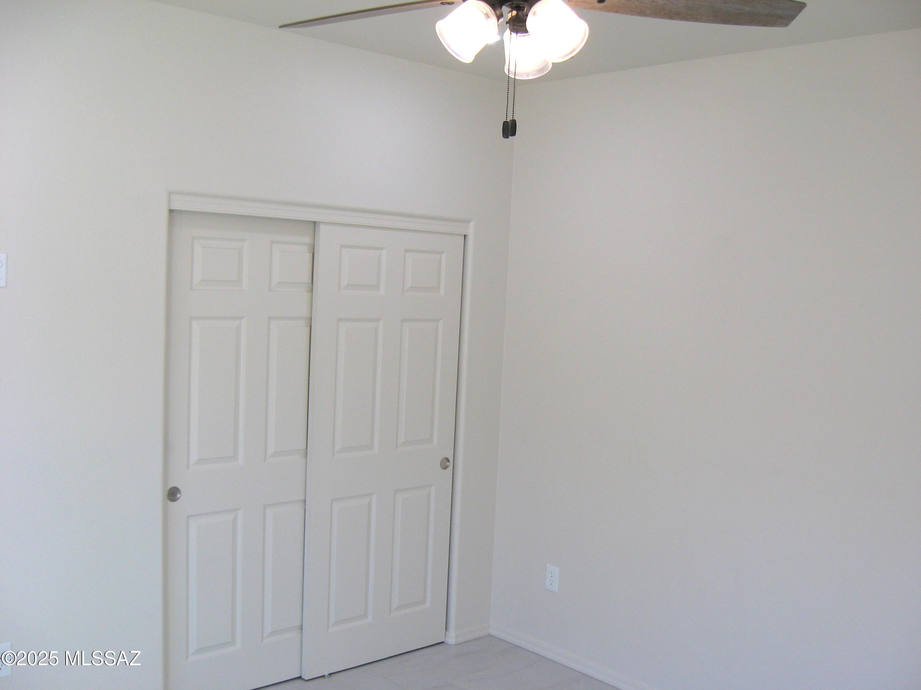 1734 Circulo Badajada Rio Rico, AZ 85648 - Photo 15 of 32 a view of a chandelier fan and closet area