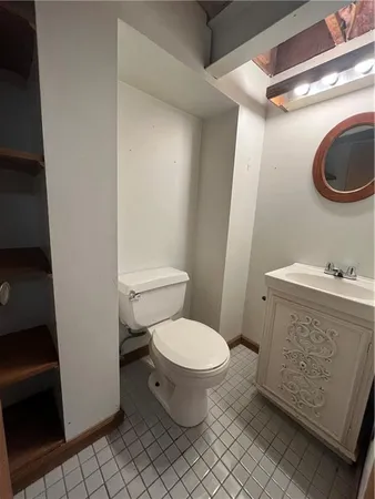 a bathroom with a toilet and a sink