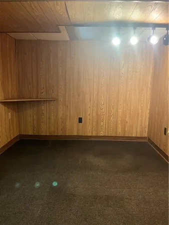 a view of an empty room with a wooden door