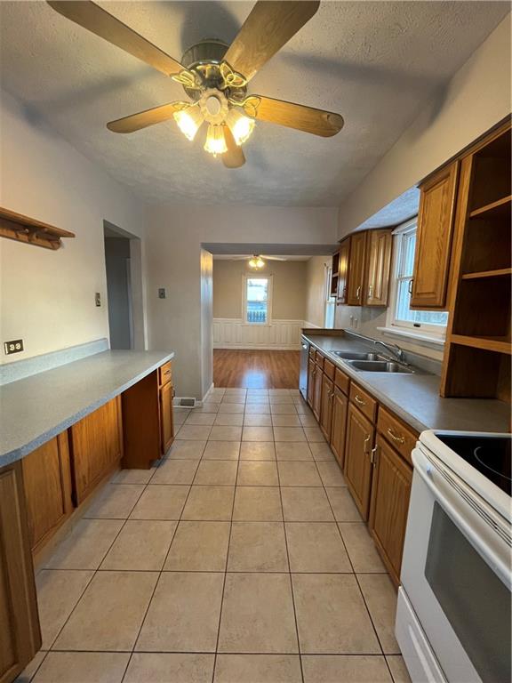 3479 Brodhead Road Monaca, PA 15061 - Photo 2 of 21 a large kitchen with kitchen island a counter space a sink and cabinets