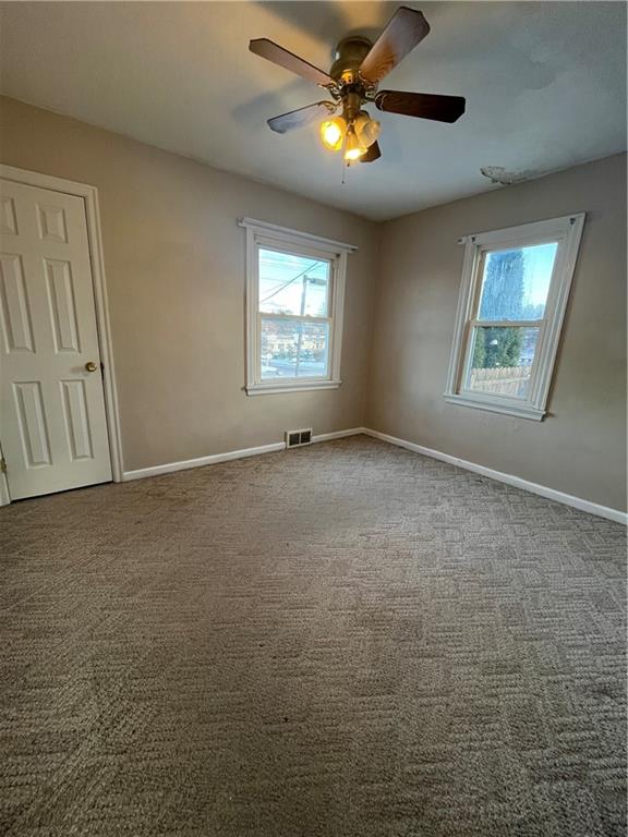 3479 Brodhead Road Monaca, PA 15061 - Photo 7 of 21 an empty room with windows and fan