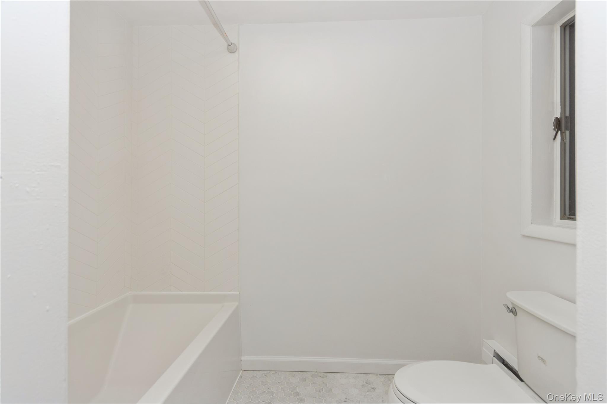 20 Lake Road Mahopac, NY 10541 - Photo 14 of 48 a white toilet sitting next to a bath tub