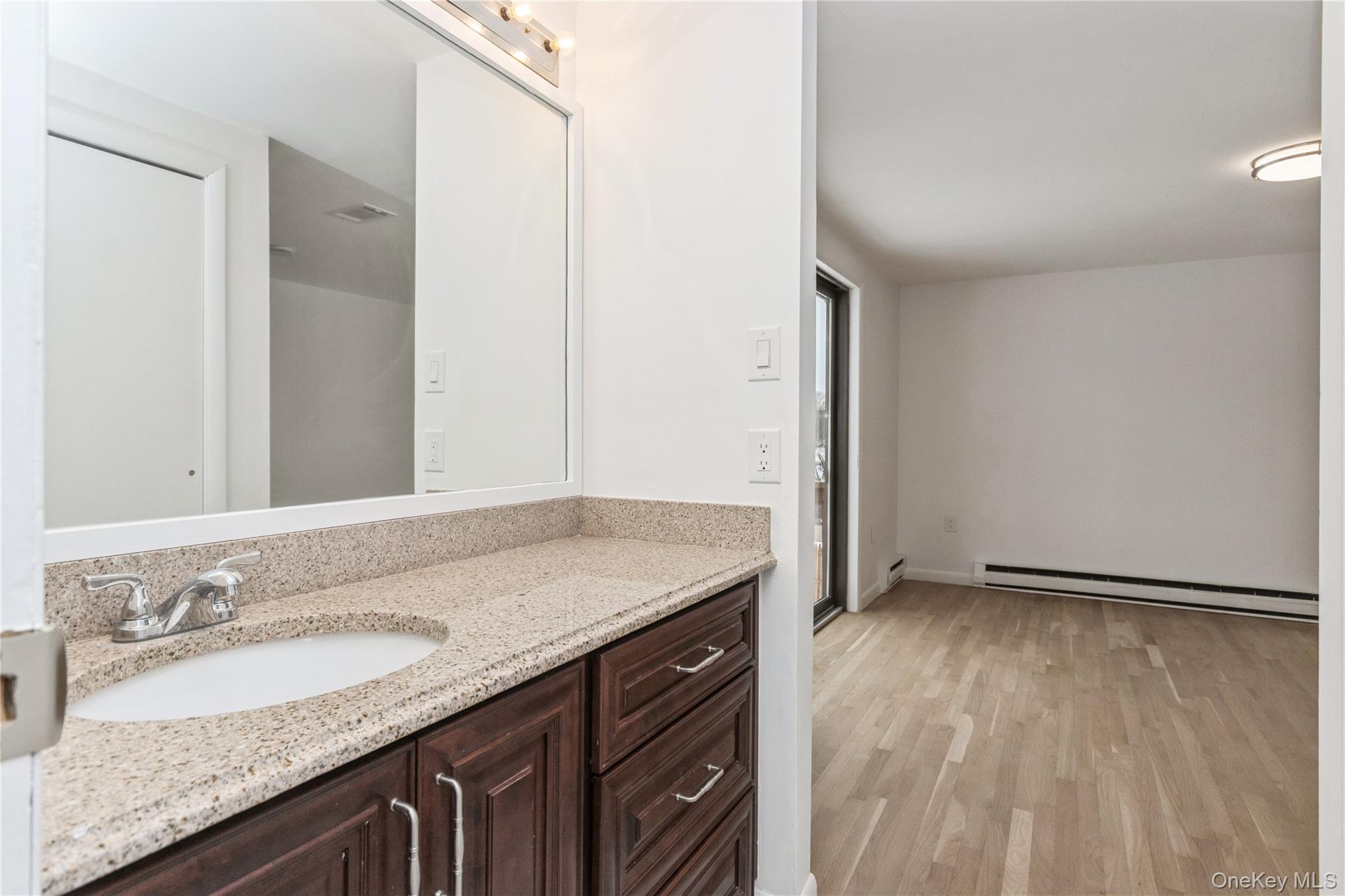 20 Lake Road Mahopac, NY 10541 - Photo 15 of 48 a bathroom with a granite countertop sink and a mirror