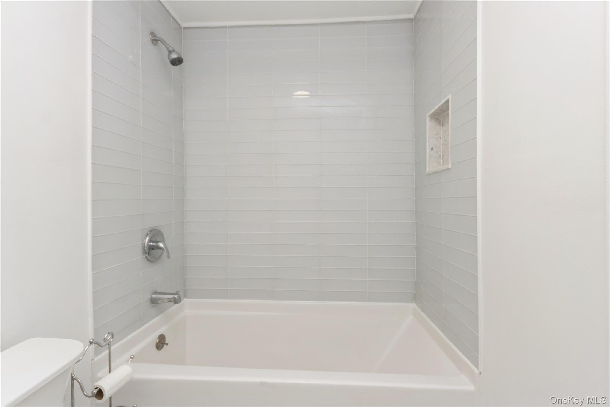 20 Lake Road Mahopac, NY 10541 - Photo 19 of 48 a white bath tub sitting next to a white toilet