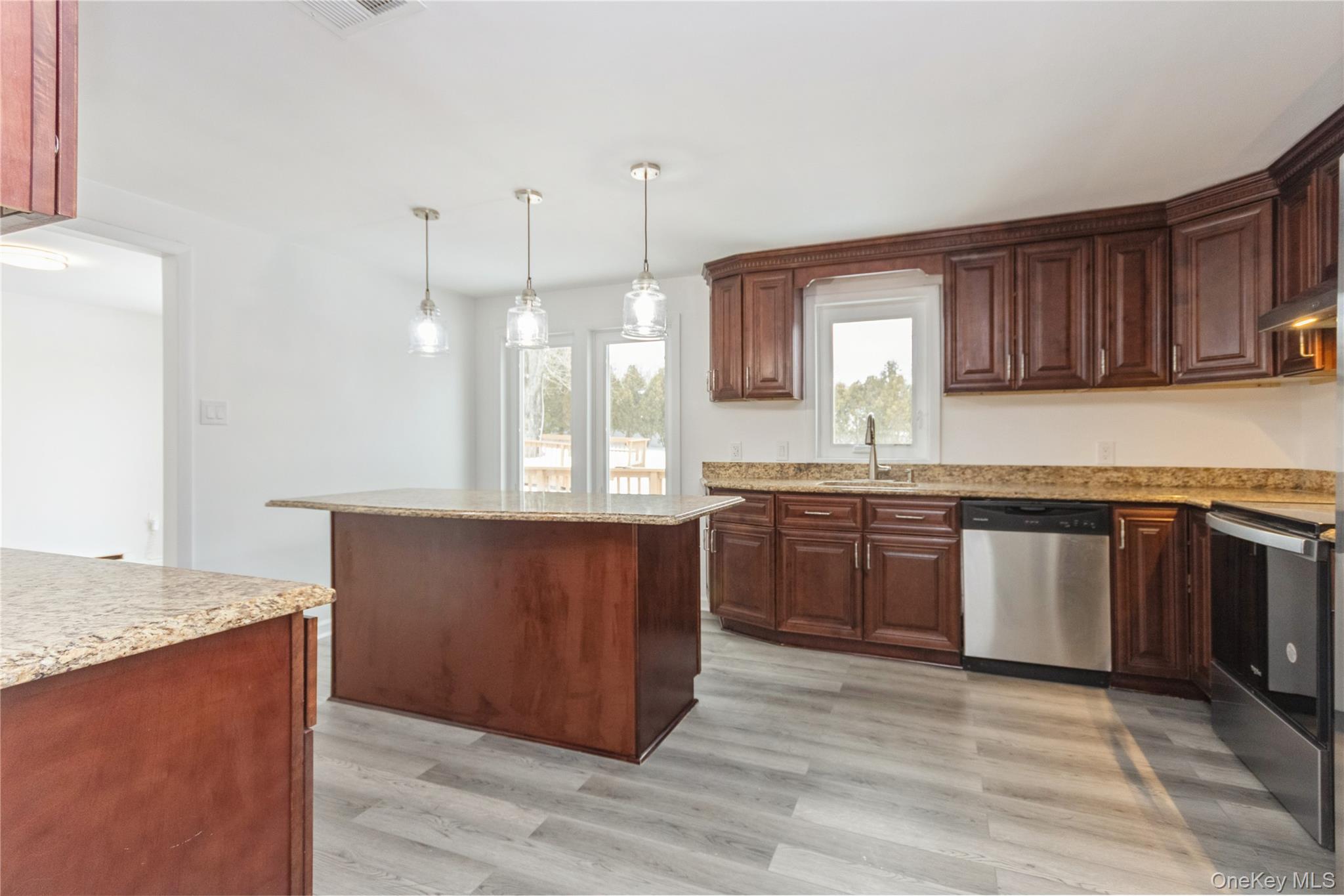 20 Lake Road Mahopac, NY 10541 - Photo 21 of 48 a kitchen with stainless steel appliances granite countertop a stove a sink dishwasher and a refrigerator