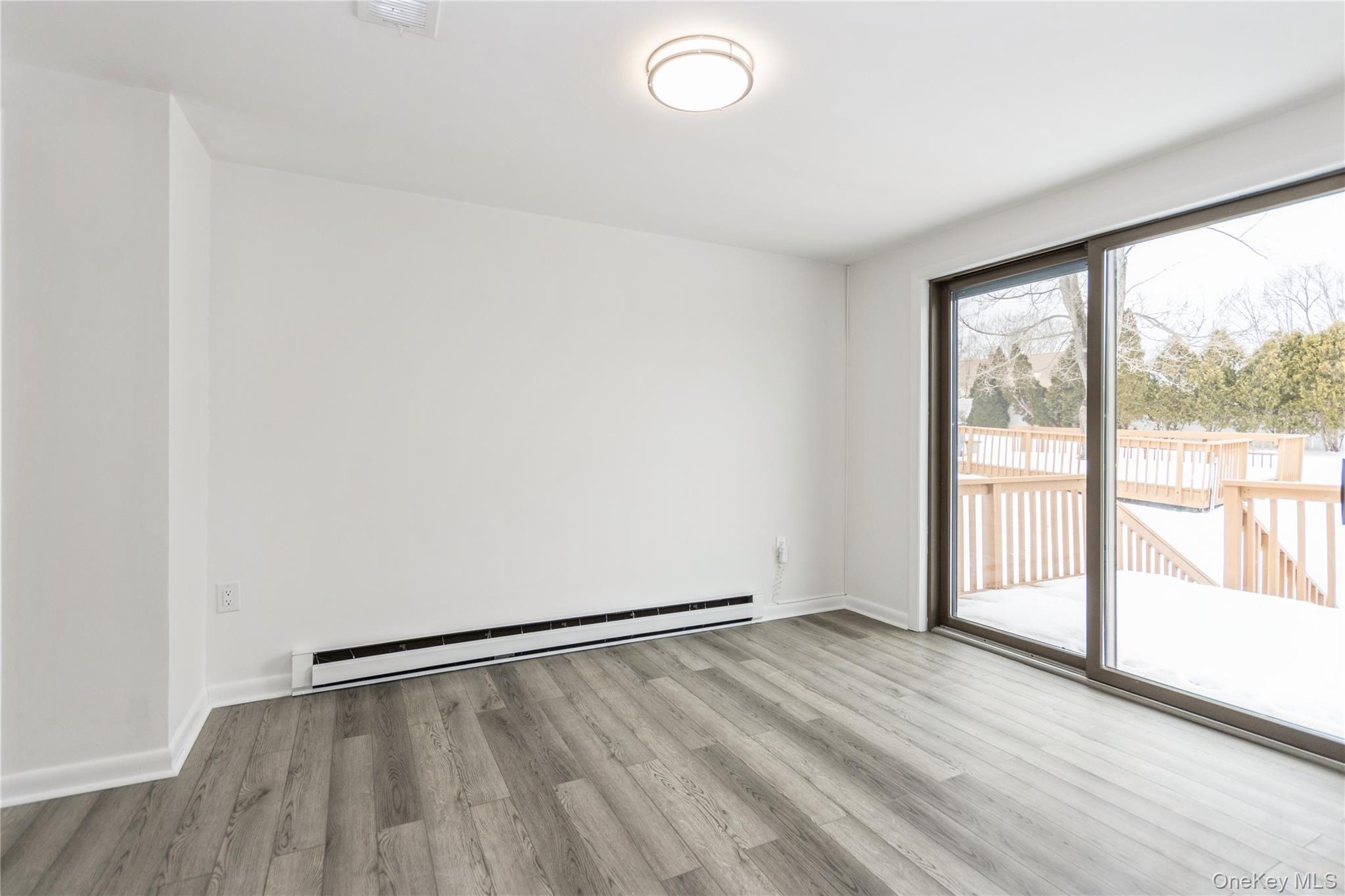 20 Lake Road Mahopac, NY 10541 - Photo 29 of 48 an empty room with wooden floor and windows