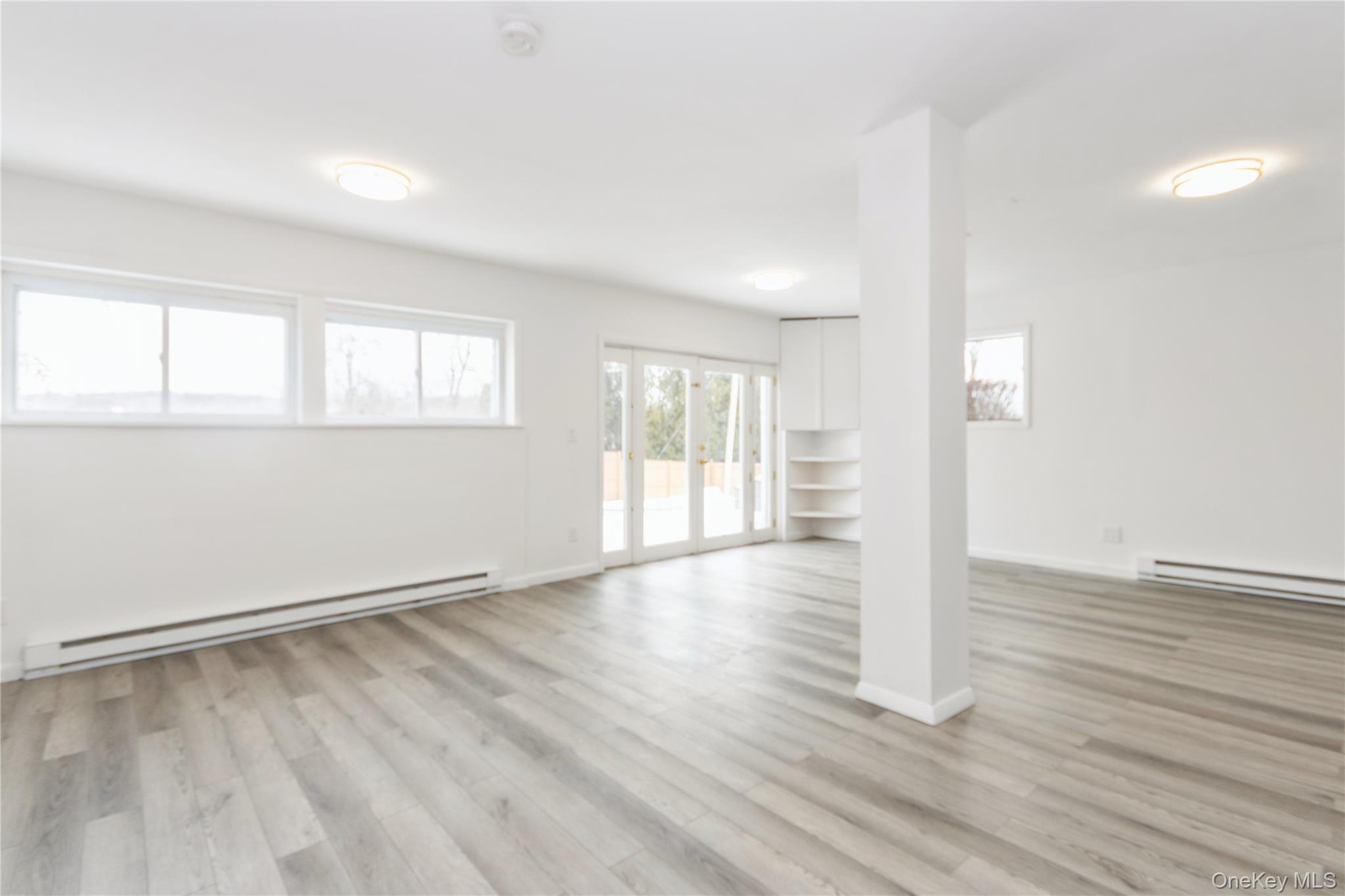 20 Lake Road Mahopac, NY 10541 - Photo 35 of 48 an empty room with wooden floor and windows