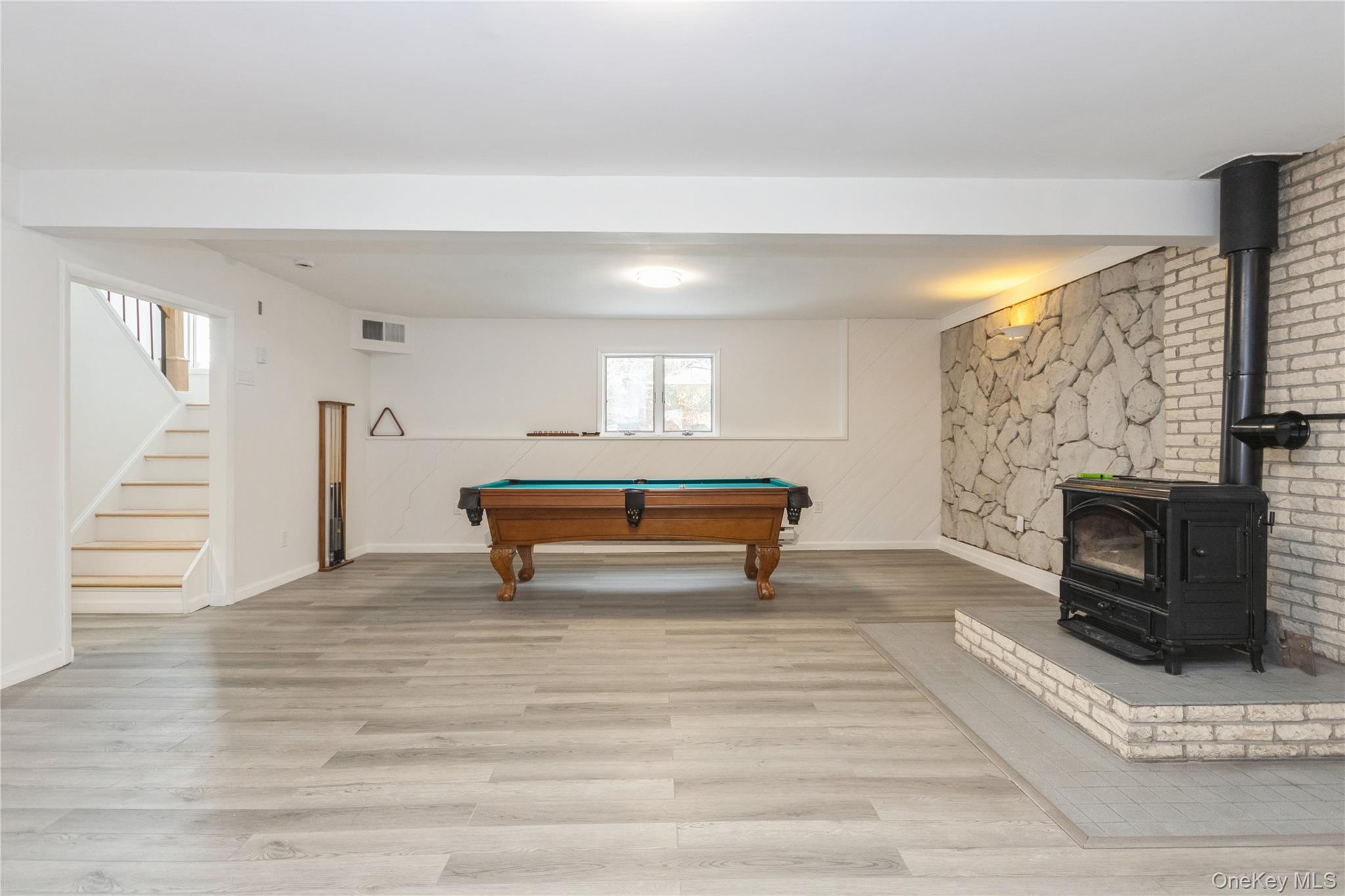 20 Lake Road Mahopac, NY 10541 - Photo 40 of 48 a room with wooden floor and a fireplace