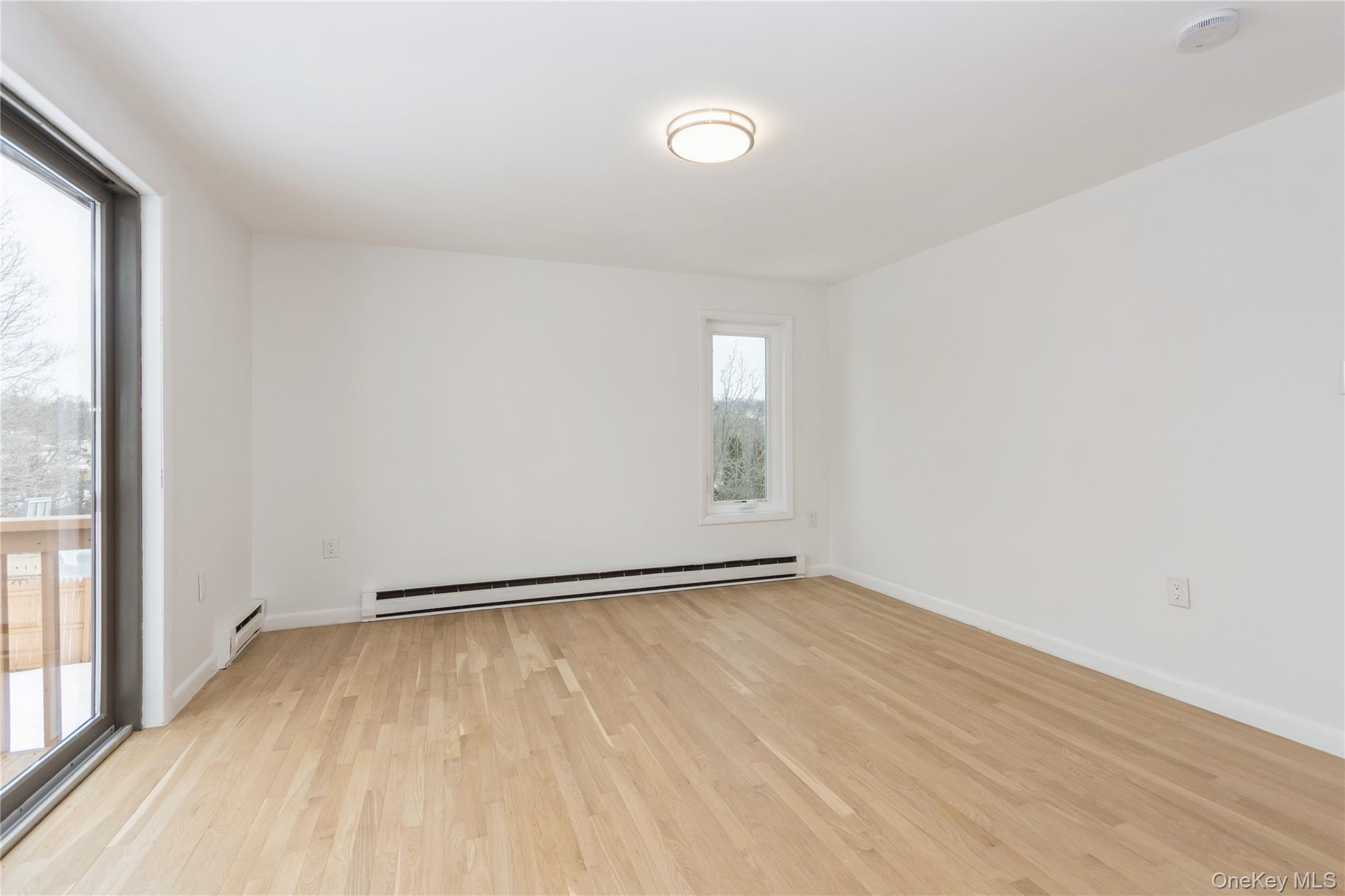 20 Lake Road Mahopac, NY 10541 - Photo 9 of 48 a view of an empty room with wooden floor and a window