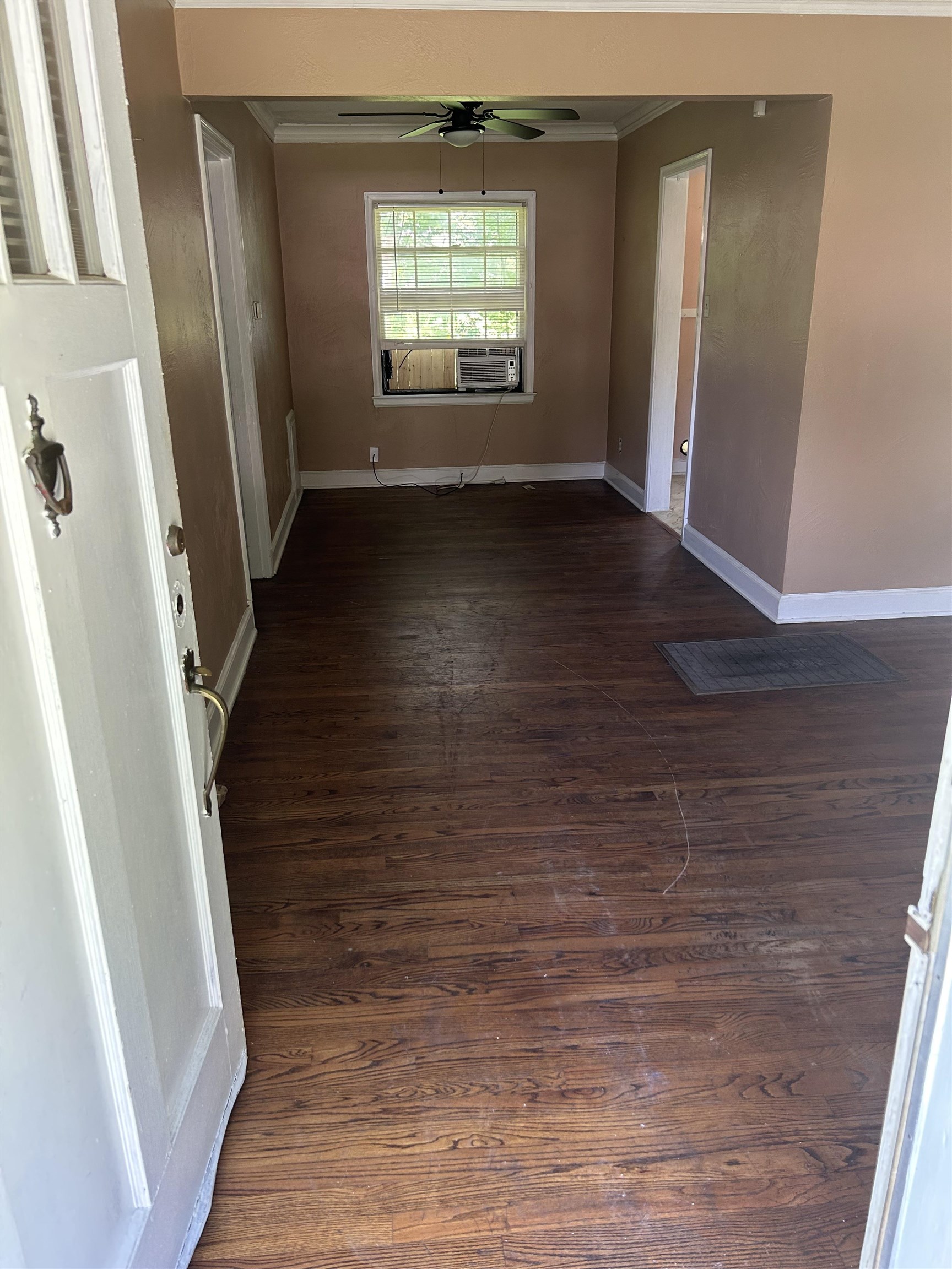 1051 Mt Vernon Road Memphis, TN 38111 - Photo 3 of 7 Spare room featuring ornamental molding, dark wood finished floors, and ceiling fan