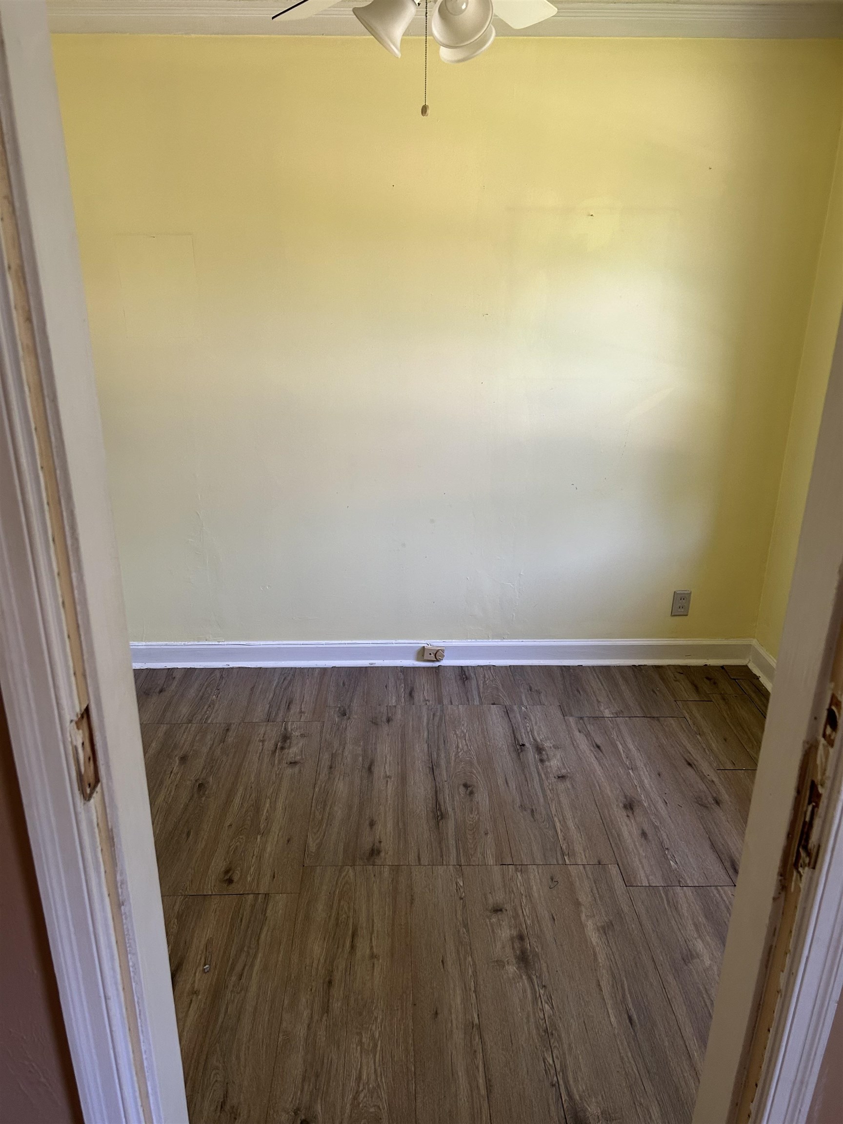 1051 Mt Vernon Road Memphis, TN 38111 - Photo 6 of 7 Spare room featuring dark wood-style floors and a ceiling fan