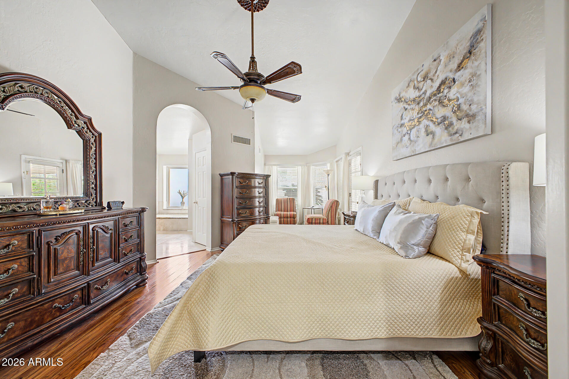 1924 East El Freda Road Tempe, AZ 85284 - Photo 25 of 56 a bedroom with a large bed and a chandelier