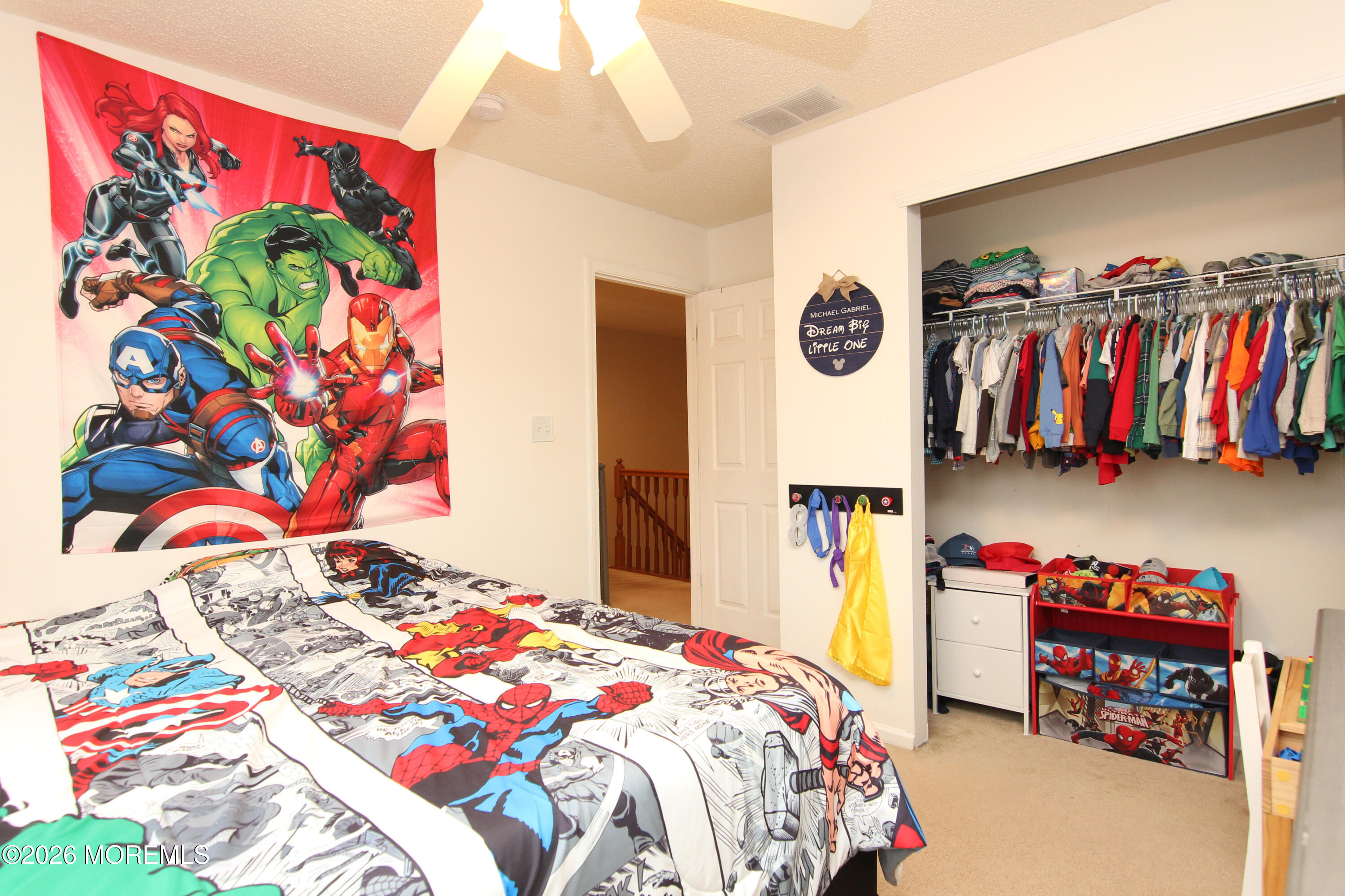 33 Austin Street Tinton Falls, NJ 07712 - Photo 16 of 46 a bedroom with a bed and a painting on the wall