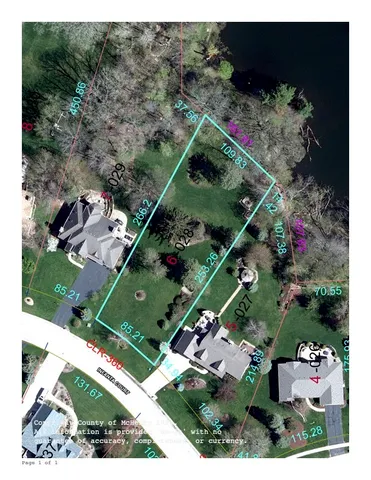 an aerial view of a residential houses with outdoor space