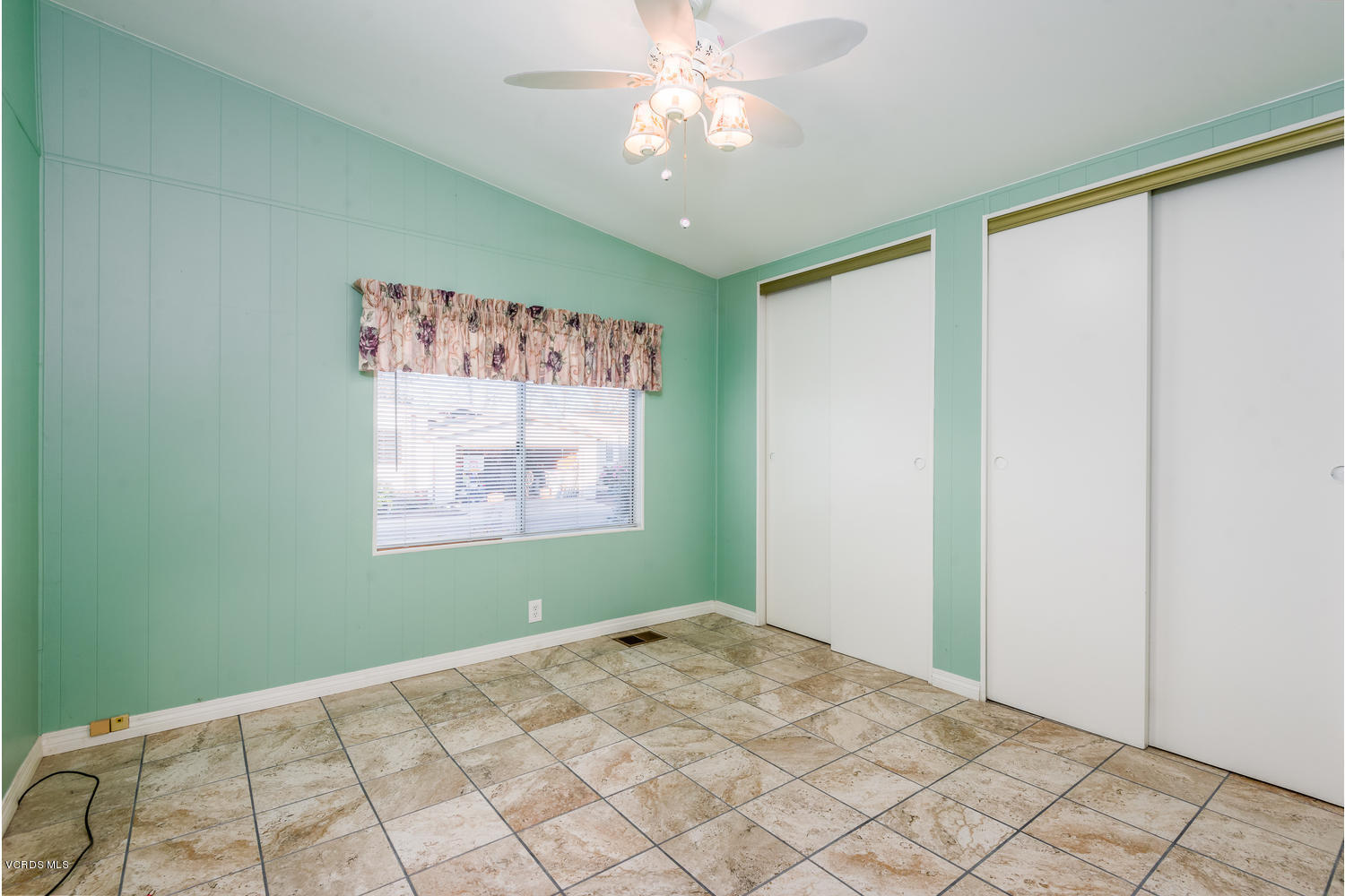 470 Raspberry Place, Unit 30 Oxnard, CA 93036 - Photo 12 of 21 a view of a big room with windows and chandelier fan