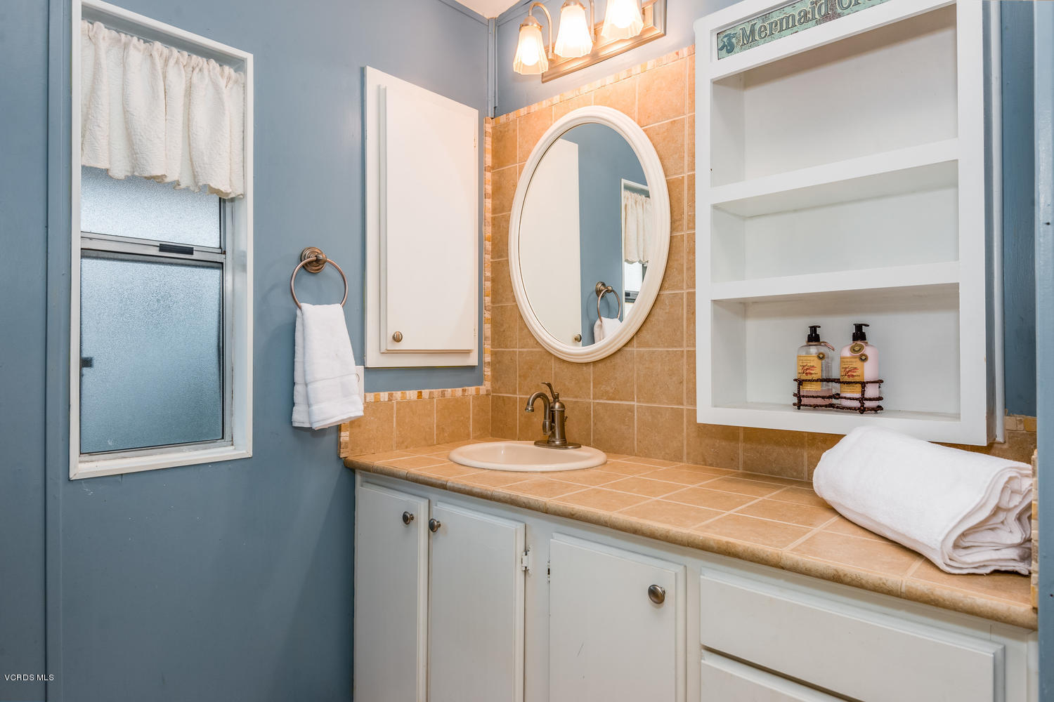 470 Raspberry Place, Unit 30 Oxnard, CA 93036 - Photo 13 of 21 a en suite bathroom with a granite countertop double vanity sink and a mirror