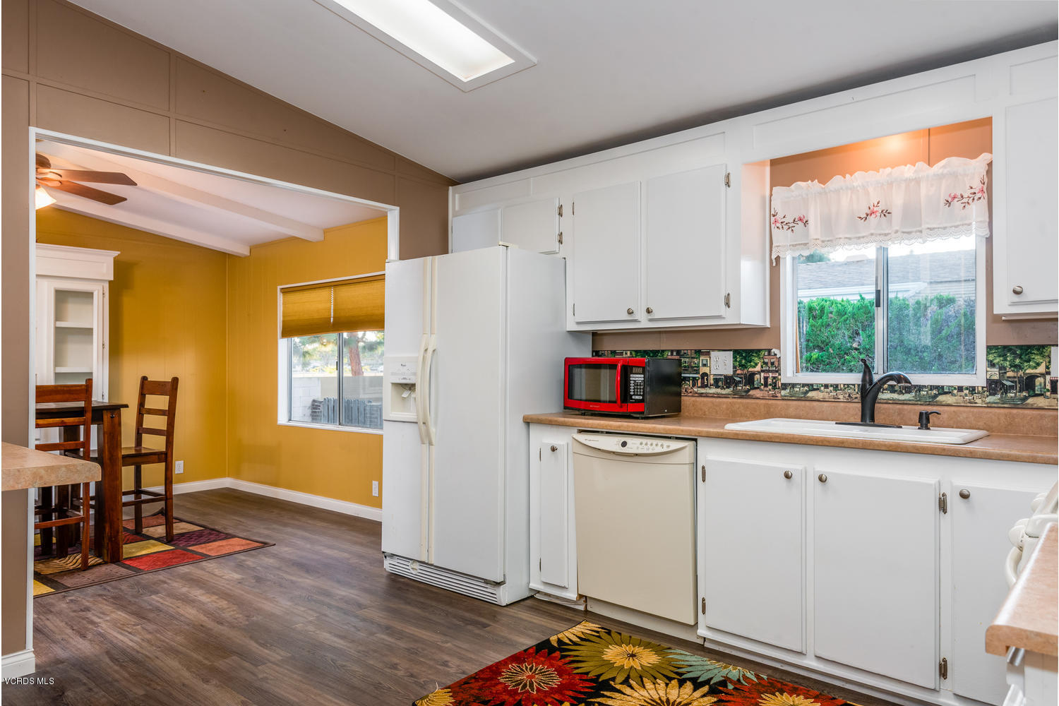 470 Raspberry Place, Unit 30 Oxnard, CA 93036 - Photo 8 of 21 a kitchen with stainless steel appliances a stove a sink and a refrigerator
