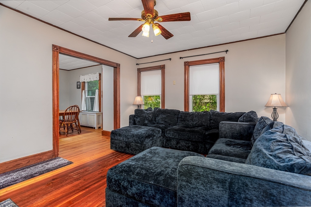 54 Charles Street Gardner, MA 01440 - Photo 11 of 40 a living room with furniture and a lamp