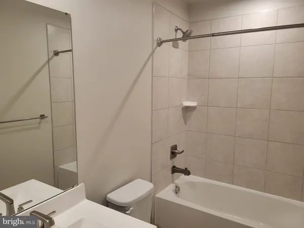 a bathroom with a toilet and a bathtub