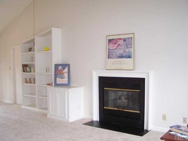 540 High Ridge Drive Durham, NC 27707 - Photo 4 of 12 The familly room is big, open, and bright offering cathedral ceilings, ceiling fan, gas log fireplace, built in entertainment cabinet with built in shelves. Large room gives way to many furniture arrangement possibilities.